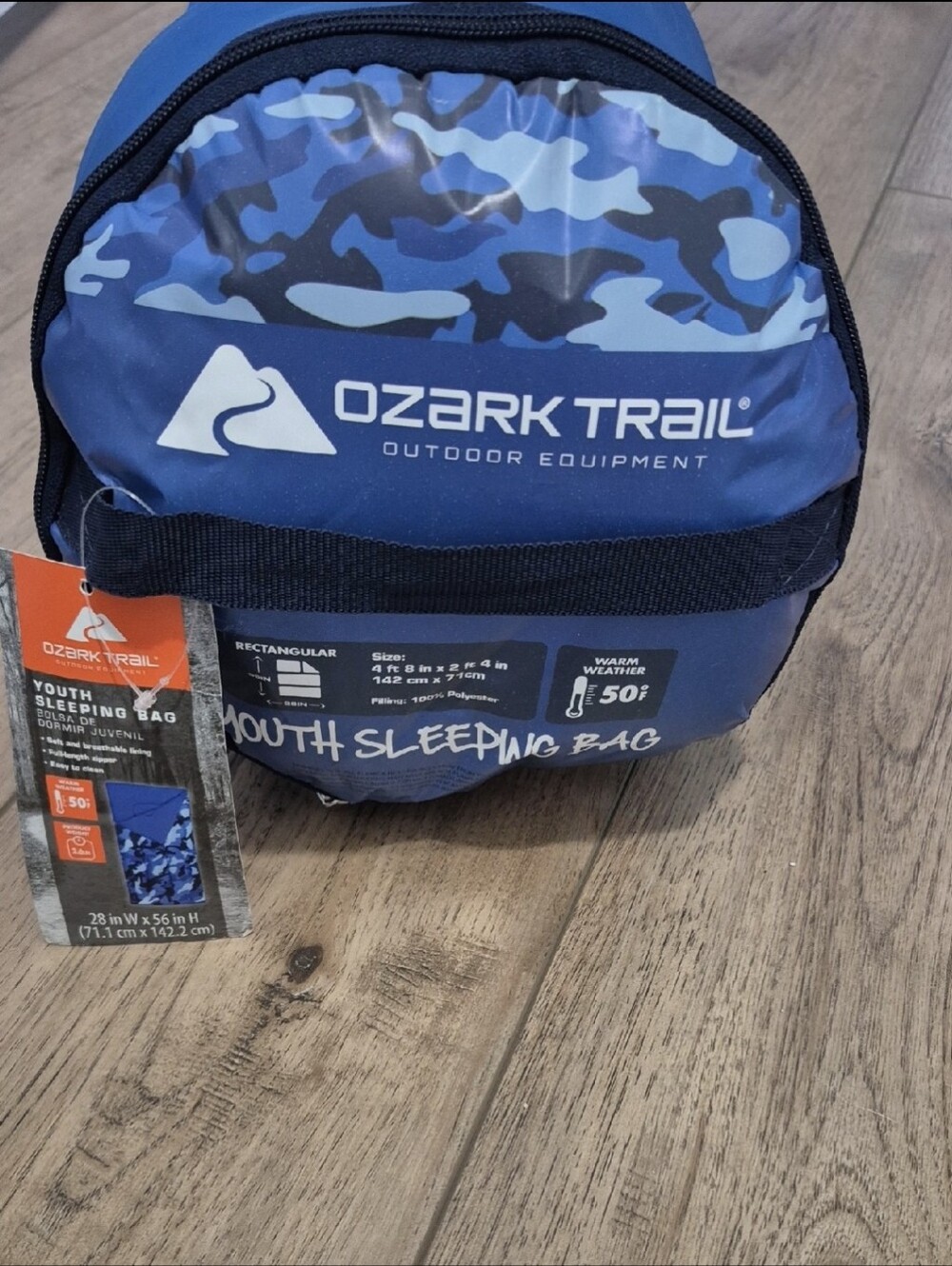 NWT Ozark Trail Youth Sleeping Bag in a blue camouflage pattern.